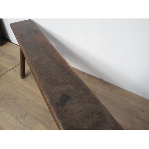 404 - An antique oak primitive Refectory Bench mounted on chamfered supports 6ft 1in L x 1ft 5 1/2in H