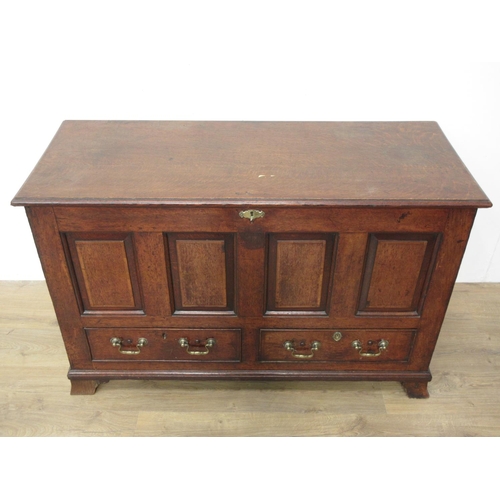 406 - A Georgian oak Mule Chest with two plank moulded lid above four panel front fitted two drawers and m... 