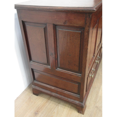 406 - A Georgian oak Mule Chest with two plank moulded lid above four panel front fitted two drawers and m... 