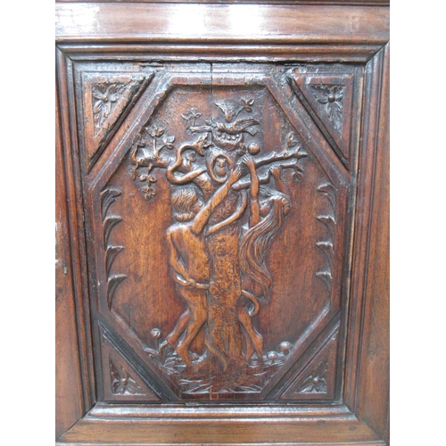 408 - An oak single door Cupboard on stand in the 17th Century style with carved panel depicting Adam and ... 