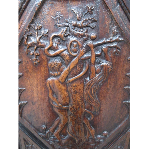 408 - An oak single door Cupboard on stand in the 17th Century style with carved panel depicting Adam and ... 