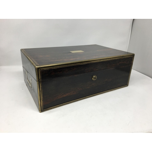 411A - A 19th Century coromandel Writing Box, brass bound with fitted interior of satinwood and marked Lund... 