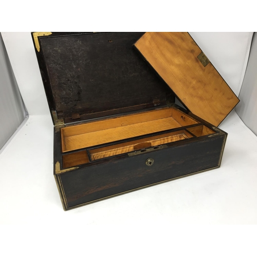 411A - A 19th Century coromandel Writing Box, brass bound with fitted interior of satinwood and marked Lund... 