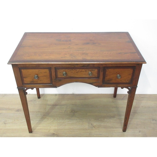 413 - A Georgian style oak and mahogany crossbanded Lowboy fitted three drawers and mounted upon square cu... 