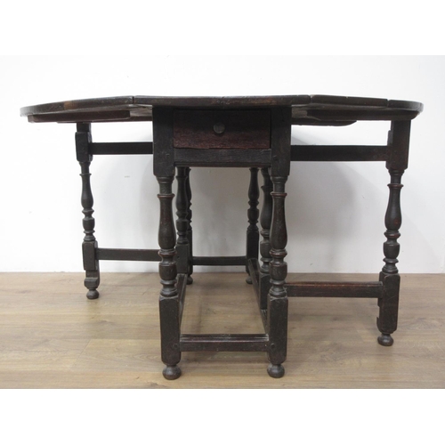 415 - A 17th Century oak Gateleg Table mounted upon turned supports 3ft 2in W x 2ft 5in H