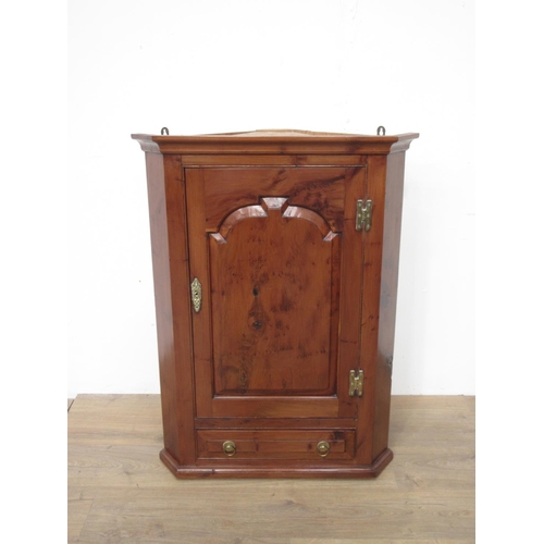 426 - A reproduction yew hanging Corner Cupboard fitted panel door and drawers 3ft 3in H x 2ft 6in W