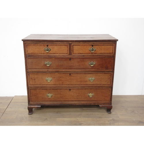 427 - A Georgian oak and mahogany crossbanded Chest of two short and three long drawers mounted upon ogee ... 