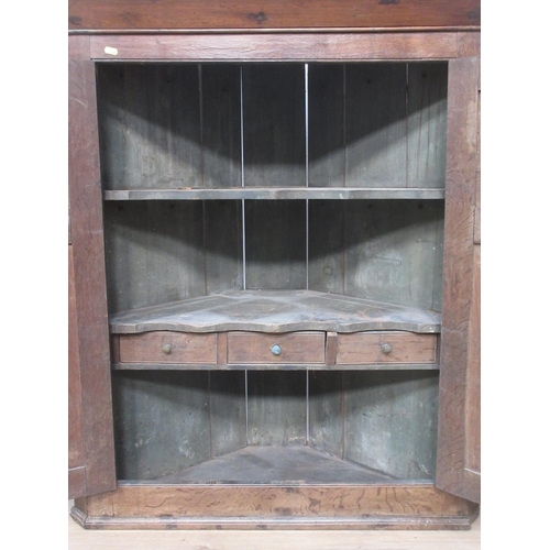 428 - A Georgian oak hanging Corner Cupboard fitted two panel doors enclosing painted interior 3ft 8in H x... 