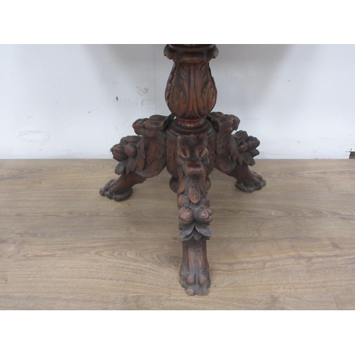 443 - A reproduction Victorian style oak Centre Table with lion mask and ring decoration mounted upon leaf... 