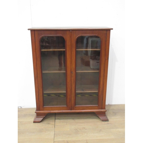 462 - A Victorian walnut and glazed two door Bookcase enclosing adjustable shelves 4ft 3in H x 3ft 5in W