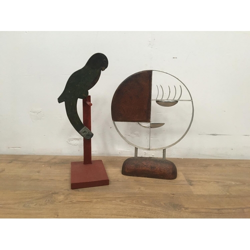 473A - A modern Sculpture of circular form, 19in H and a painted wooden 