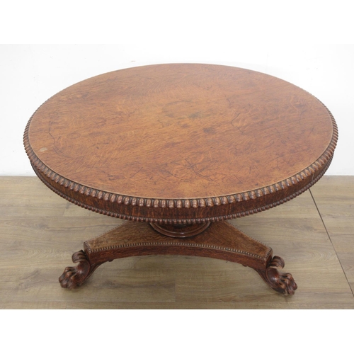 493 - A 19th century oak Breakfast Table mounted upon paw feet (one chewed) 3ft 10in D x 2ft 4in H