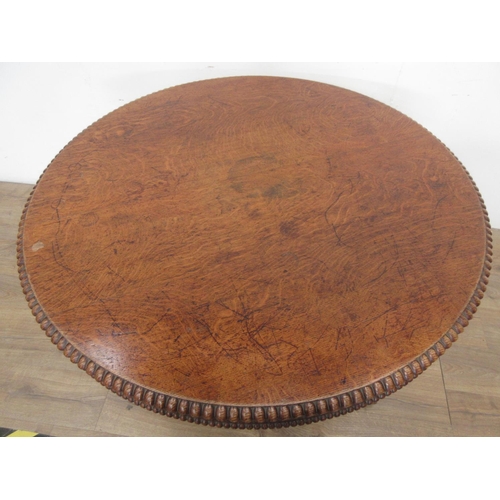 493 - A 19th century oak Breakfast Table mounted upon paw feet (one chewed) 3ft 10in D x 2ft 4in H