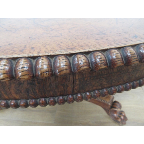 493 - A 19th century oak Breakfast Table mounted upon paw feet (one chewed) 3ft 10in D x 2ft 4in H