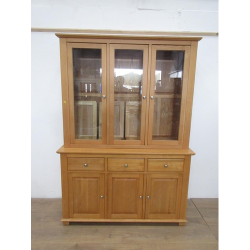 508 - A modern oak veneered and glazed Bookcase the base fitted three drawers above three cupboard doors 6... 