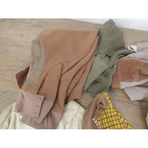 521 - A wicker Linen Basket containing a quantity of old costume including Waistcoats, Cape and Breeches