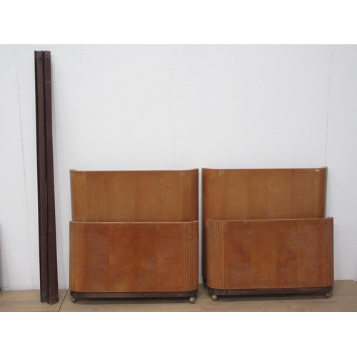 530 - A pair of walnut and rosewood veneered Art Deco single Bedsteads 3ft 4in W and a brass single Bedste... 