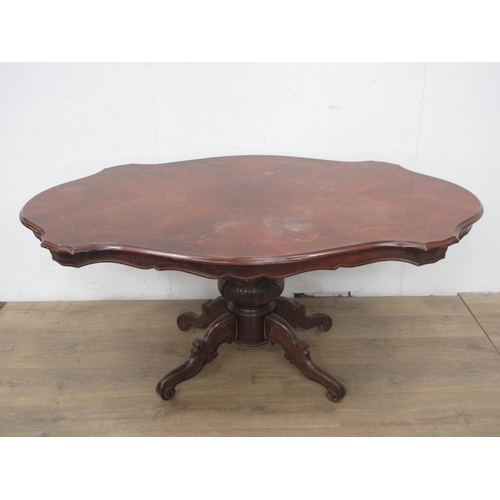 531 - A reproduction mahogany and marquetry veneered Loo Table with shaped top of four carved supports 5ft... 