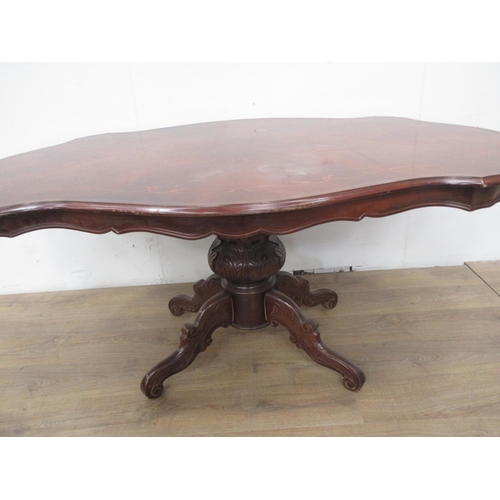 531 - A reproduction mahogany and marquetry veneered Loo Table with shaped top of four carved supports 5ft... 