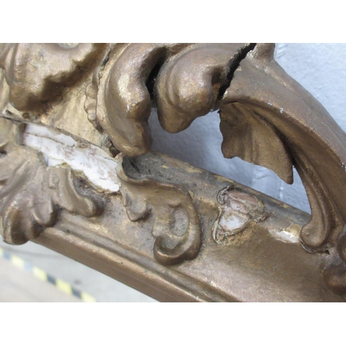 535 - An antique gilt framed Wall Mirror with scroll surmount A/F 4ft H x 1ft 10in W