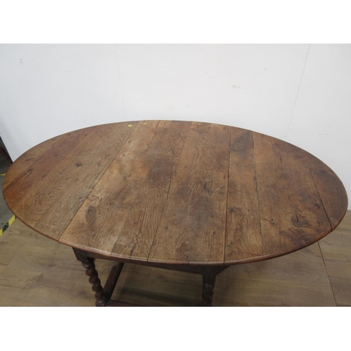 539 - An antique oak Gateleg Dining Table on barleytwist supports united by stretchers 4ft W x 2ft 5in H