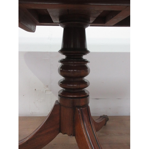 541 - A 19th Century mahogany Breakfast Table with moulded top mounted upon turned column and three legs w... 