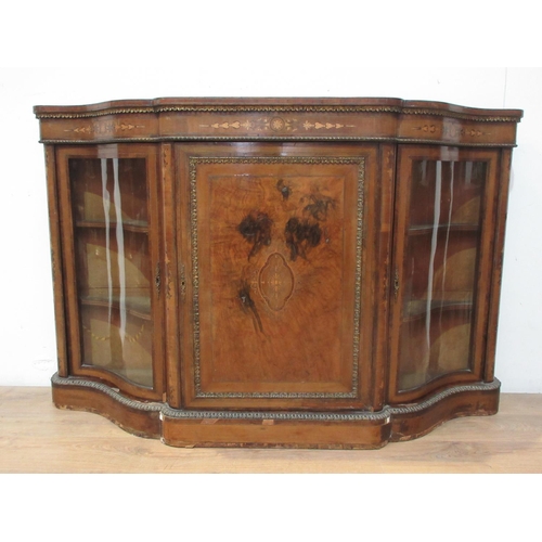 542 - A Victorian walnut veneered and inlaid Credenza with gilt metal mounts fitted pair of shaped glazed ... 