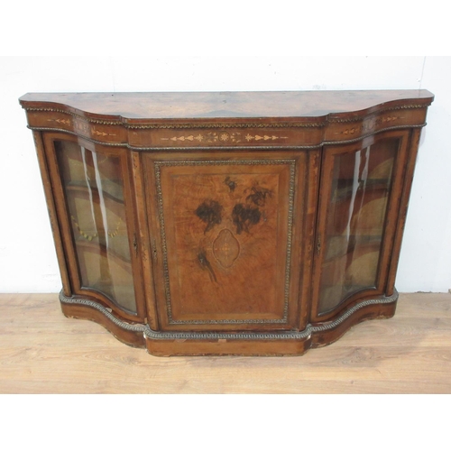 542 - A Victorian walnut veneered and inlaid Credenza with gilt metal mounts fitted pair of shaped glazed ... 