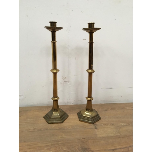 542A - A large pair of brass Church type Candlesticks with hexagonal stems and bases, 2ft 1in H