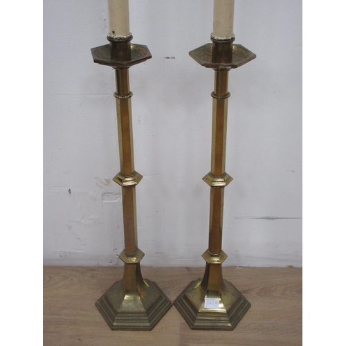 542A - A large pair of brass Church type Candlesticks with hexagonal stems and bases, 2ft 1in H