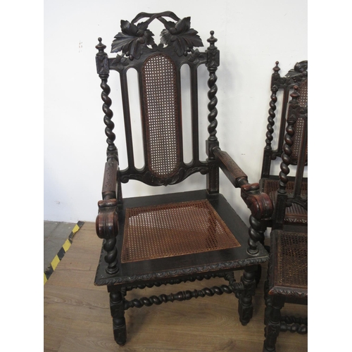 548 - A set of eight Victorian oak and cane Dining Chairs on barleytwist supports, viz; two carvers and si... 