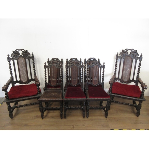 548 - A set of eight Victorian oak and cane Dining Chairs on barleytwist supports, viz; two carvers and si... 