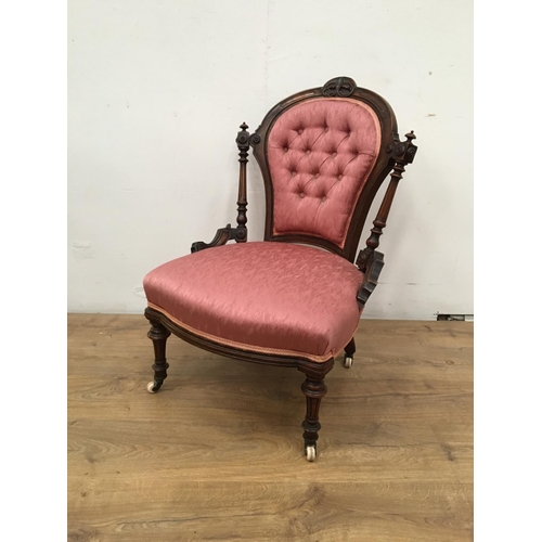 558A - A 19th Century walnut Bedroom Chair with pink button upholstery on turned front supports and casters