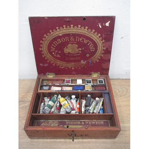 569 - A Winsor and Newton mahogany watercolour Box with paints and palette