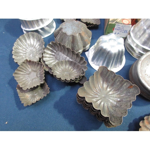 57 - A large quantity of small Jelly Moulds and Cake Tins/Cases