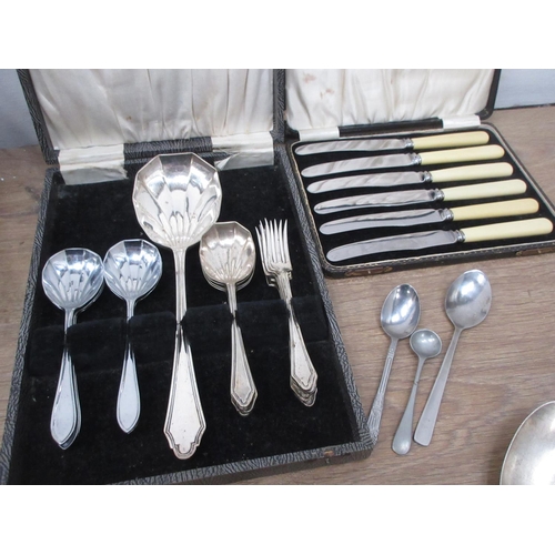 578 - A Box of Silver Plate and Cutlery including, a three piece Coffee Set, Spoons, Knifes, Brush Set, an... 