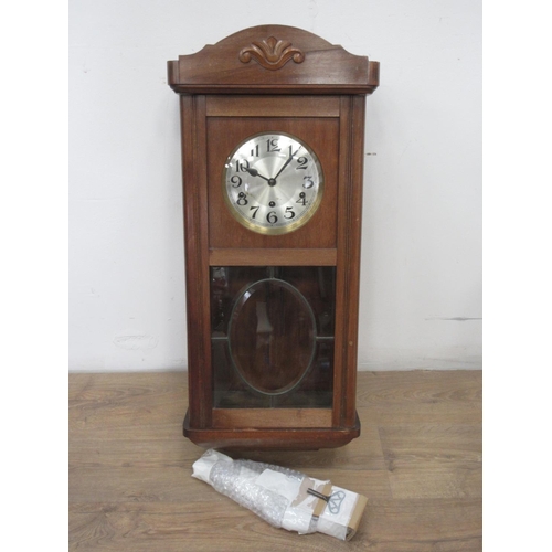 582 - A 20th Century walnut cased Wall Clock 2ft 8in H x 1ft 2in W