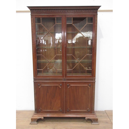 73 - A reproduction Georgian style mahogany and astragal glazed Bookcase, maker, Robson & son, Newcastle ... 