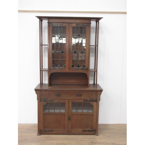 75 - A Liberty's style Arts and Crafts oak Cabinet fitted leaded glass doors and drawers 6ft 8in H x 3ft ... 