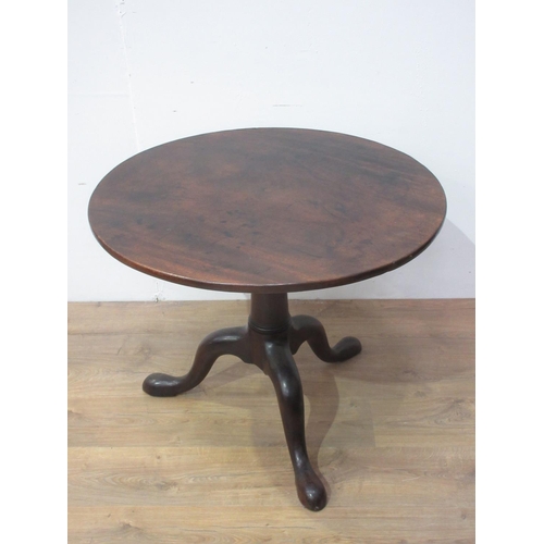 94 - A Georgian mahogany Pillar Table with single piece top mounted upon turned column and pad feet 2ft 8... 