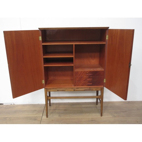 118 - A 1970's Danish style mahogany two door Cupboard fitted two brushing slides 4ft 3in H x 2ft 11in W