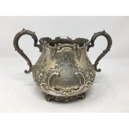 252 - A Victorian silver two-handled Sugar Bowl with presentation inscription, floral embossing, London 18... 