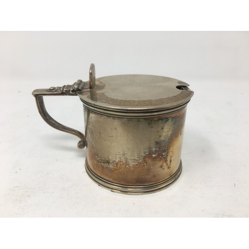 253 - A Victorian silver drum Mustard Pot with blue glass liner, London 1866.