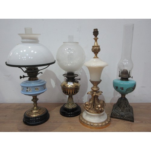 502A - Three oil Lamps and a gilt and onyx Table Lamp