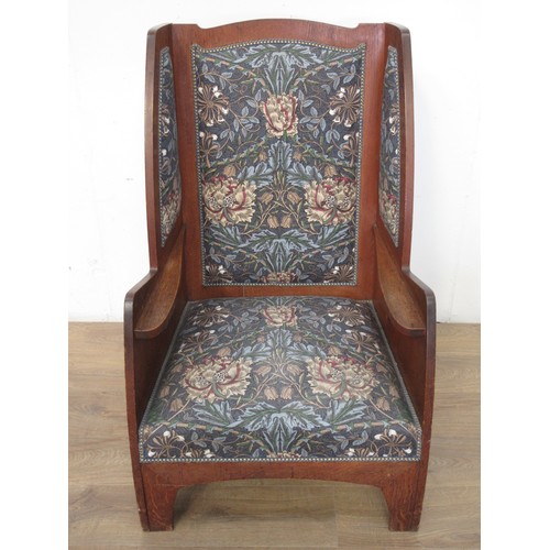 513 - An oak Wingback Armchair with William Morris style upholstery 3ft 7in H x 2ft 2in W