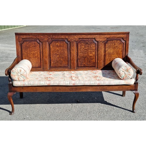 550 - An 18th Century oak Settle with four panel back on cabriole supports and pad feet 6ft W x 3ft 6in H