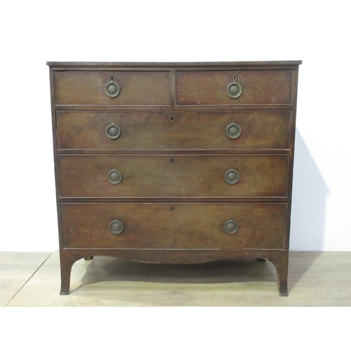 133 - A 19th Century mahogany Chest of two short and three long graduated drawers mounted upon splayed fee... 