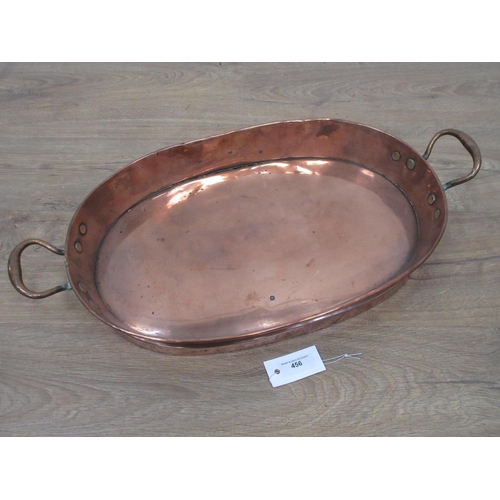 456 - An antique brass two handled oval Pan 2ft W