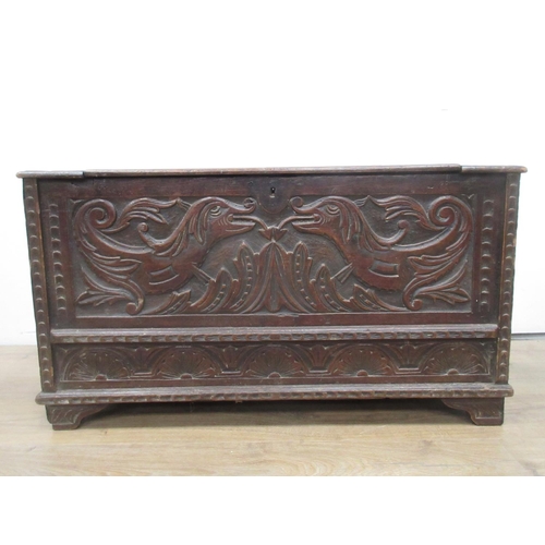 457 - A carved oak Chest with hinged lid 3ft 1in W x 1ft 8in H