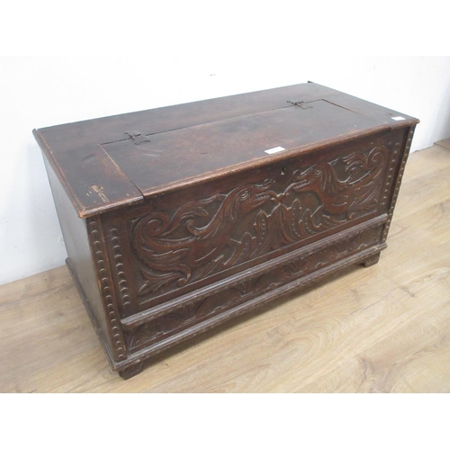 457 - A carved oak Chest with hinged lid 3ft 1in W x 1ft 8in H